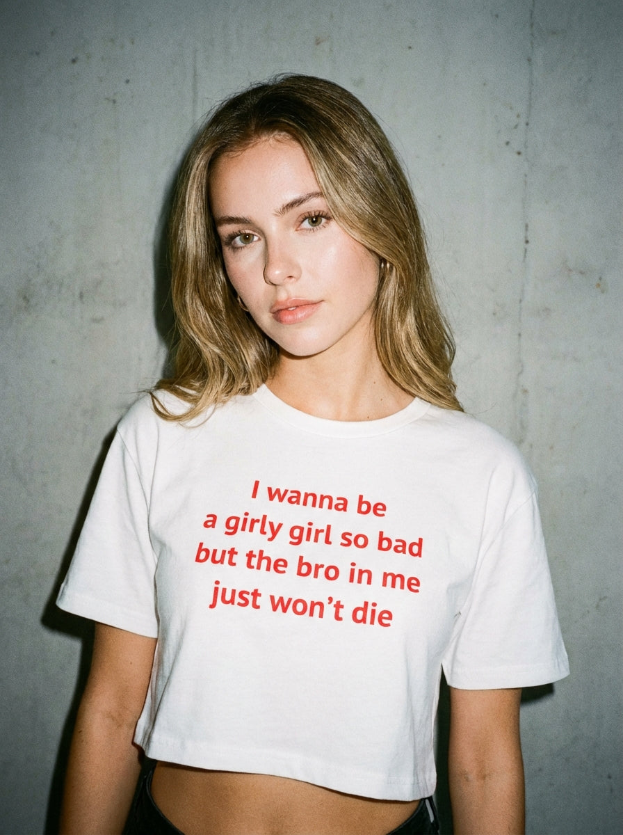 "I wanna be a girly girl so bad but the bro in me just won’t die" crop top
