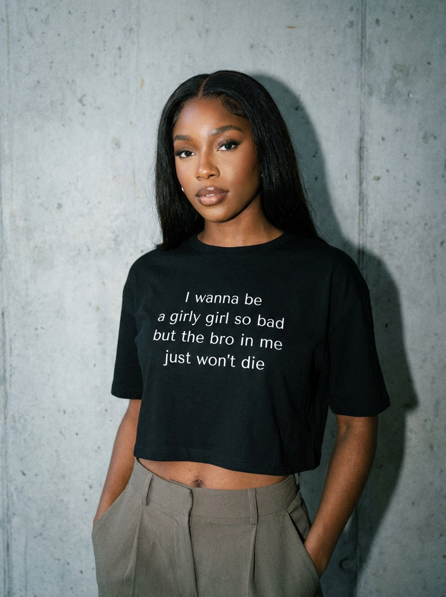"I wanna be a girly girl so bad but the bro in me just won’t die" crop top